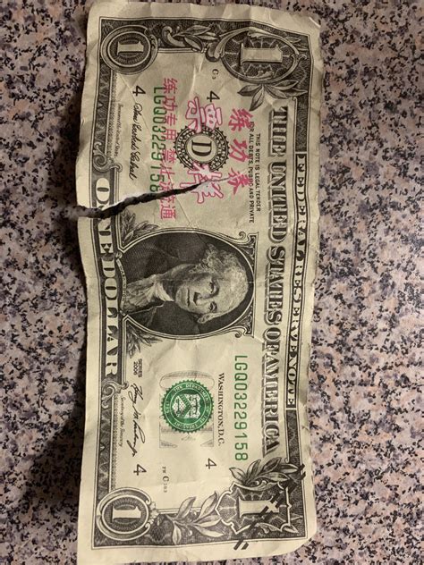 [Unknown > English] Found this fake dollar bill on the ground today ...