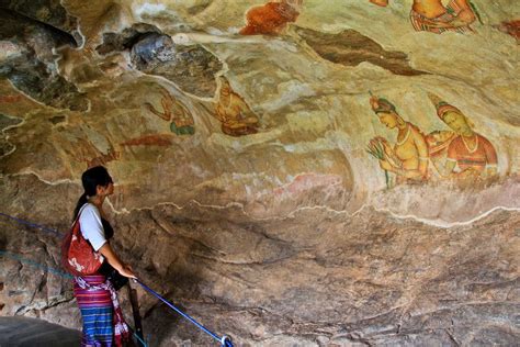 Sigiriya rock paintings are dating back to 5th century AD and made by ancient artisans using ...