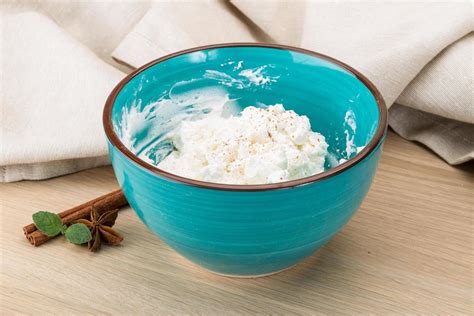 Ricotta cheese in a bowl on wooden background 11735858 Stock Photo at ...