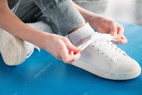 Girl tying shoelace — Stock Photo © NatashaFedorova #147982755