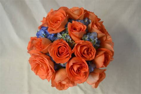 Classic orange and blue bridal bouquet with roses and hydrangea. Fleurish Floral Designs ...