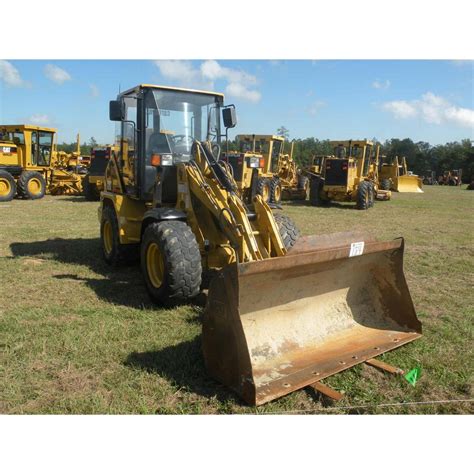 CAT 906 WHEEL LOADER - J.M. Wood Auction Company, Inc.