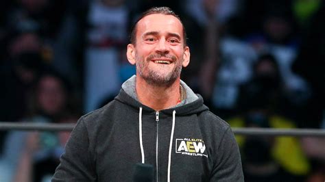 AEW star CM Punk poses with 'trans rights are human rights' sign at All In event | Fox News