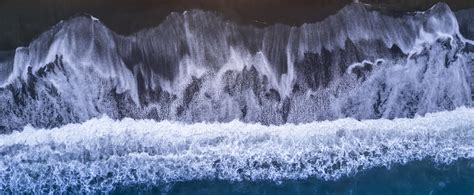 An aerial shot of a black sand beach near Kaikoura in NZ [Composition ...