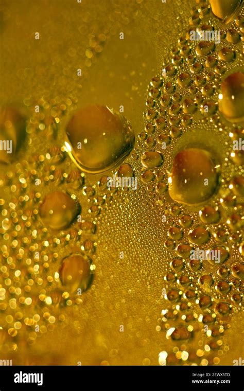 Macro shooting of water droplets beside the glass surface close up liquid drops modern ...