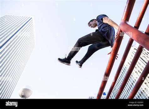 Man jumping over fence in city hi-res stock photography and images - Alamy