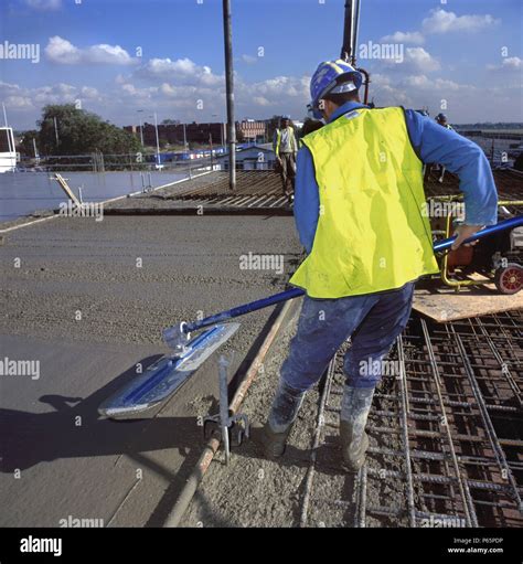 Screeding in situ reinforced concrete slab Stock Photo - Alamy