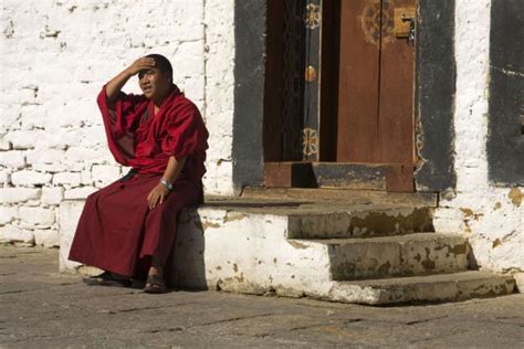 Bhutanese monk taking a break in Trongsa Dzong | Bhutanese monks | Bhutan | Travel Story and ...