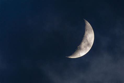 Crescent moon and clouds Photograph by Tom Bushey - Fine Art America