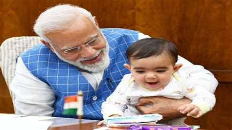 Prime Minister Narendra Modi playing with baby in Parliament photos ...