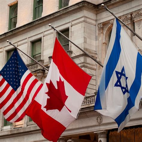 Premium Photo | Flags on a building in manhattan, new york city, u.s.a.