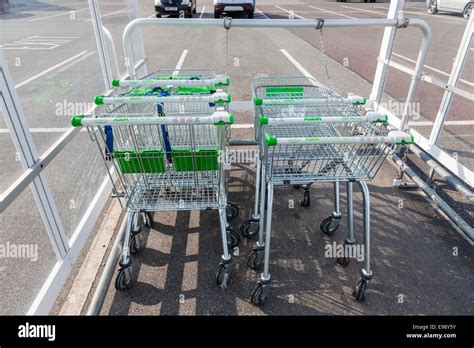 Asda shopping trolleys in a shelter, Nottinghamshire, England, UK Stock Photo - Alamy