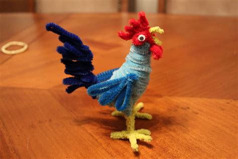 a knitted chicken on a wooden table