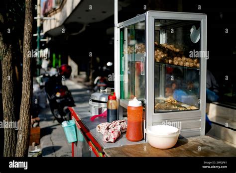 Hawker street food in the city. Street food cart called pentol or bakso in the pedestrian Stock ...