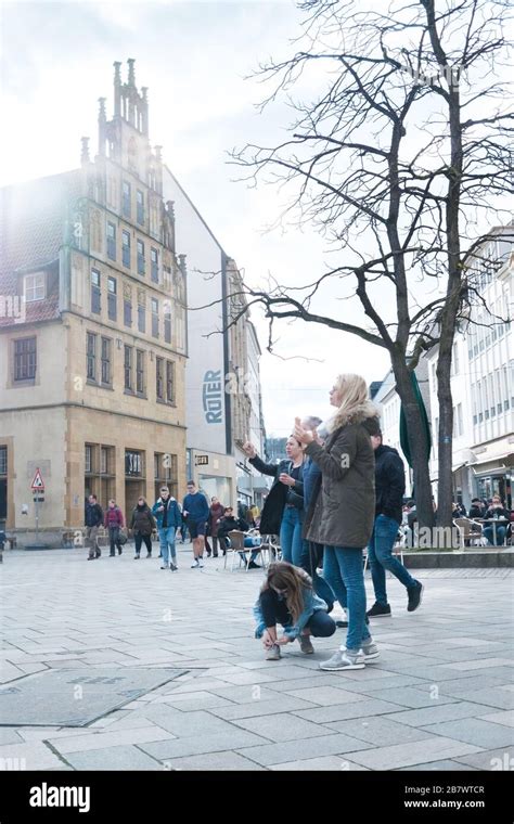 a young family spending time in the old town of Bielefeld, Germany ...