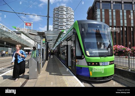 A Tramlink tram stops at East Croydon station in Croydon, Surrey Stock Photo - Alamy