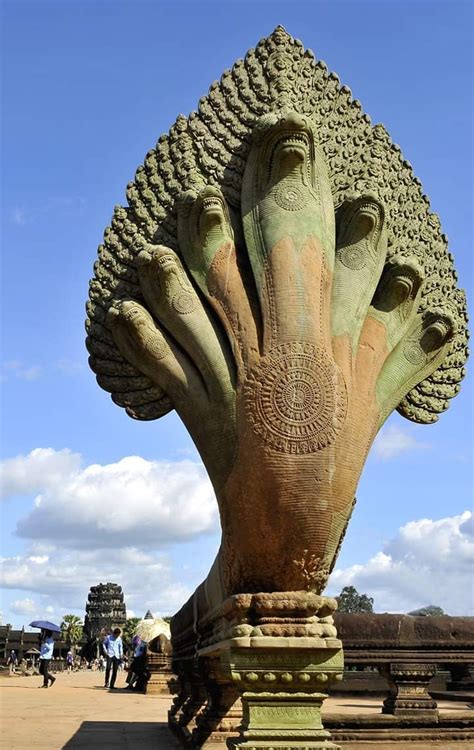 The 7-headed Naga at the entrance of the Angkor Wat Temple I Cambodia. Built by the Hindu King ...