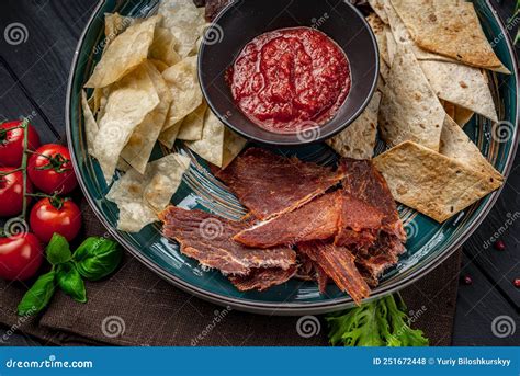 Various Types of Dried Meat with Spicy Sauce Stock Photo - Image of chips, maize: 251672448