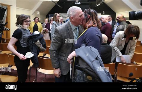 Jackie McDonald of Ulster Defence Association (UDA) is hugged by a well wisher at a press ...