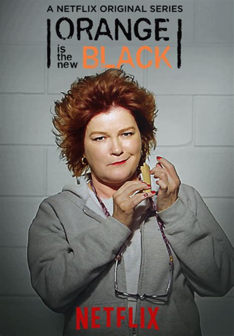 an orange is the new black poster with a woman holding a piece of food in her hands