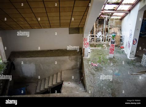 Interior of the Pyramid of Tirana with Enver Hoxha bust painted as a Joker, Tirana, Albania ...