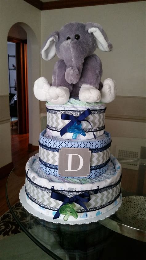 Baby boy diaper cake made with receiving blankets and ribbon. | Baby diaper cake boy, Diaper ...