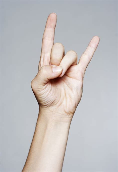 Hand Giving the Devil Horns Gesture Stock Image - Image of female, people: 31217769