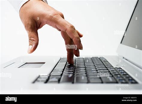 Typing on a laptop Stock Photo - Alamy