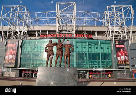 The statue to Sir Bobby Charlton, George Best Denis Law at the main ...