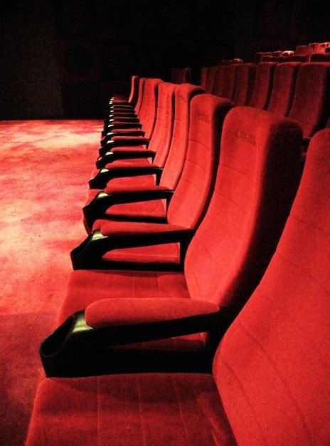 Premium Photo | Empty red seats in movie theater