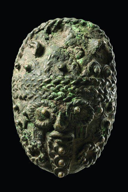 ukpuru: Igbo Ukwu bronze mask pendant, 9th...