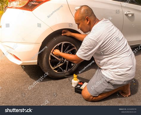 Car Flat Tire Repair By Use Stock Photo 2121029774 | Shutterstock