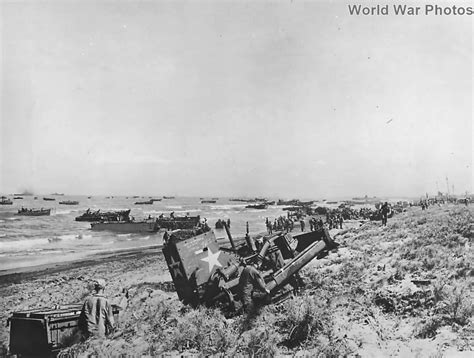 Armored bulldozer at work as troops land on Luzon Beach Lingayen '45 | World War Photos