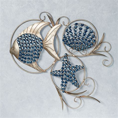 three metal wall art pieces with blue beads in the shape of fish and ...