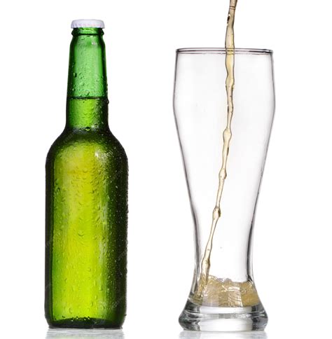 Premium Photo | Pouring beer from bottle isolated on white background