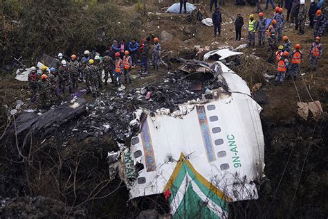 Gallery: Nepal Plane Crash Leaves Dozens Dead - Caixin Global