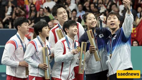 A Heartwarming Moment: The Impactful Podium Selfie of North and South Korean Athletes at the ...