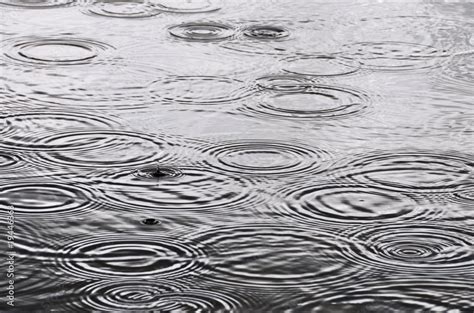 Raindrops on the water surface Stock Photo | Adobe Stock