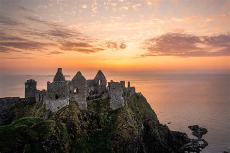 Download Dunluce Castle Ruin Northern Ireland Sunset Horizon Wallpaper ...