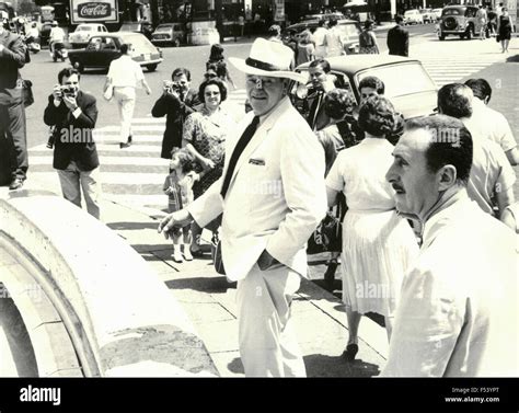 The American actor John Wayne walking in Rome , Italy Stock Photo - Alamy