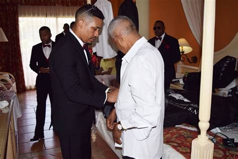 Groomsmen getting ready for the wedding inside a hotel room at the Bahia Principe Bavaro ...