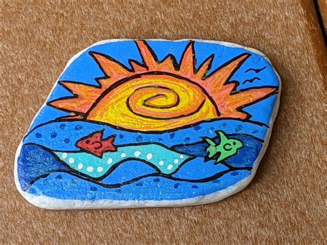 Ocean sunrise painted rock | Sunrise painting, Painted rocks, Rock