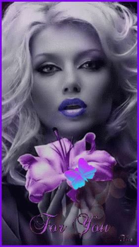 a woman with blue lipstick holding a flower