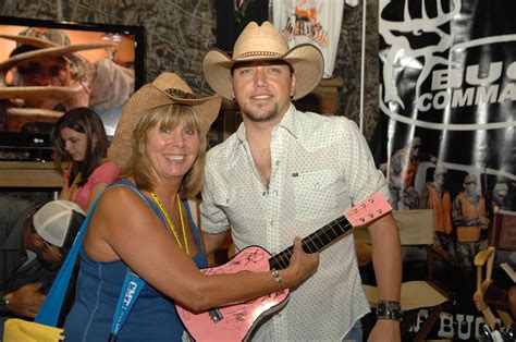 Jason Aldean meeting a fan in the Exhibit Hall at CMA Fest 2010 ...