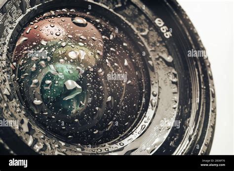 Close up beautiful Camera lens of drop water, on a white Background ...