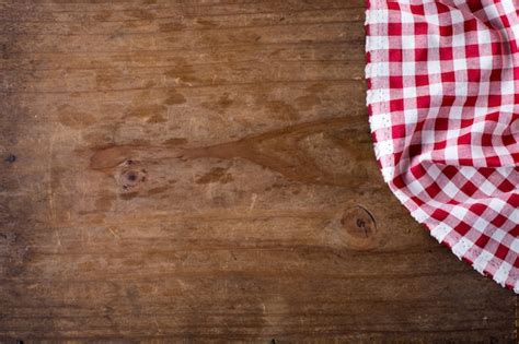 Premium Photo | Red table cloth on wooden background