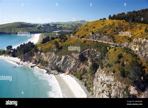 Seasider Train above Cliffs at Doctors Point near Dunedin South Island New Zealand aerial Stock ...