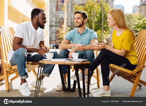 Easy going young people enjoying lovely conversation Stock Photo by ...