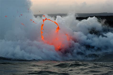 Kilauea volcano lava flow spitting into the air and ocean | Flickr