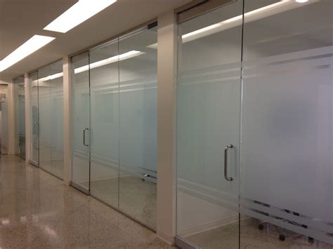 Decorative window film install in dental office Dallas, Tx